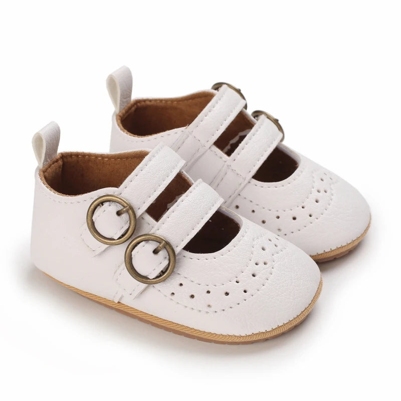 A pair of white breathable baby first walker sandals with soft anti-slip soles.