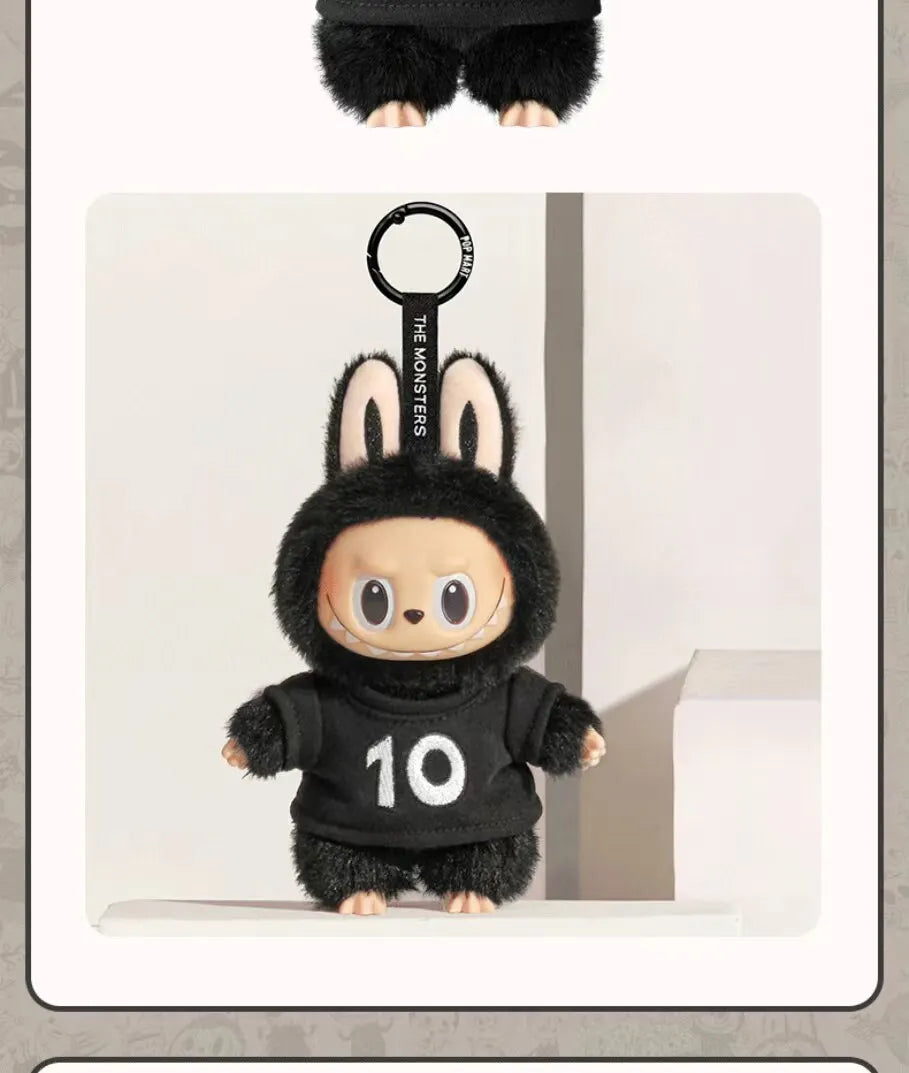 A black Labubu figure wearing a black hoodie with the number 10, displayed against a light background.