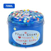 A jar of blue slime putty with colorful sprinkles and a cat face design.