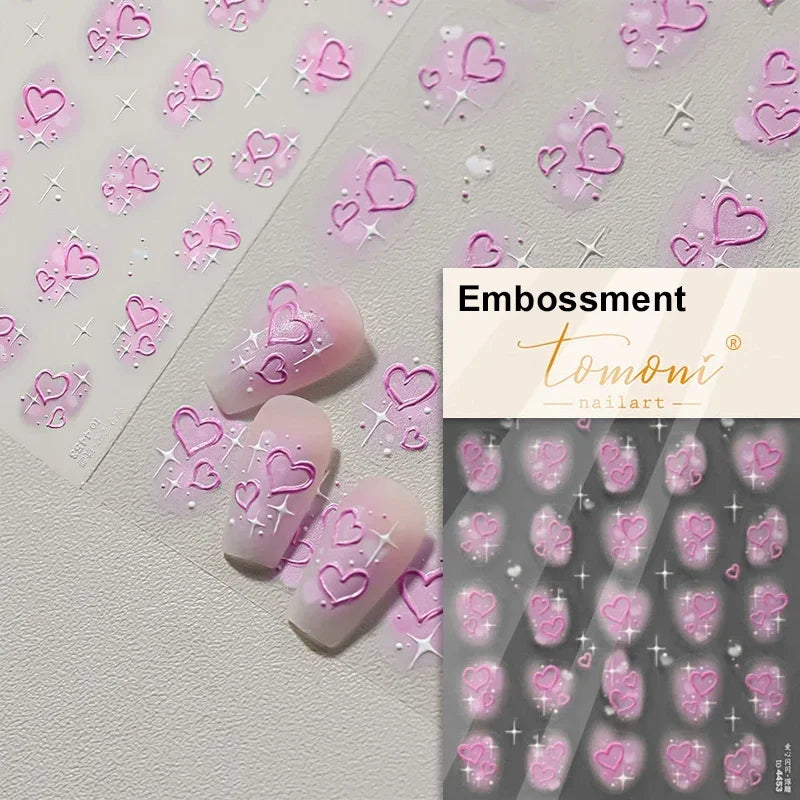 Embossment nail art stickers featuring pink and purple hearts on a light background