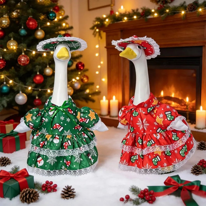 A white festive porch goose with seasonal red and green fabric decor sitting in front of a fireplace.