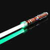 An RGB metal lightsaber with a glowing green blade and an orange hilt, shown against a black background.