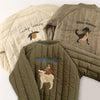 Olive green padded jacket featuring a lucky lemon and dino dance print on the back