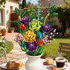 A vibrant floral display made from building blocks in various colors arranged in a white vase outdoors.