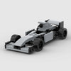 A gray and black LEGO building block model of a classic rally car.
