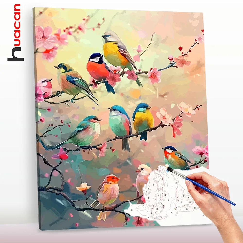 A painting featuring various colorful birds perched on branches with pink flowers, done in a paint by numbers style.