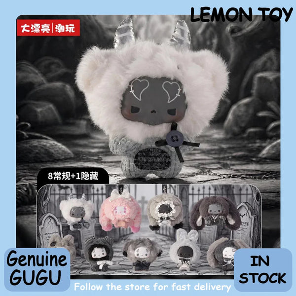 A fluffy white and grey-toned doll pendant with horns is displayed against a dark background.