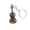 A vintage violin keychain featuring a metallic brown body and silver hardware.