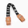 A black canvas belt with white mustache pattern and a tan leather buckle and strap.