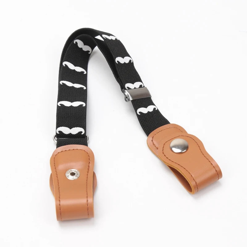 A black canvas belt with white mustache pattern and a tan leather buckle and strap.