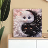 Diamond painting of a cat shaped like Yin Yang, featuring white and black fur patterns.