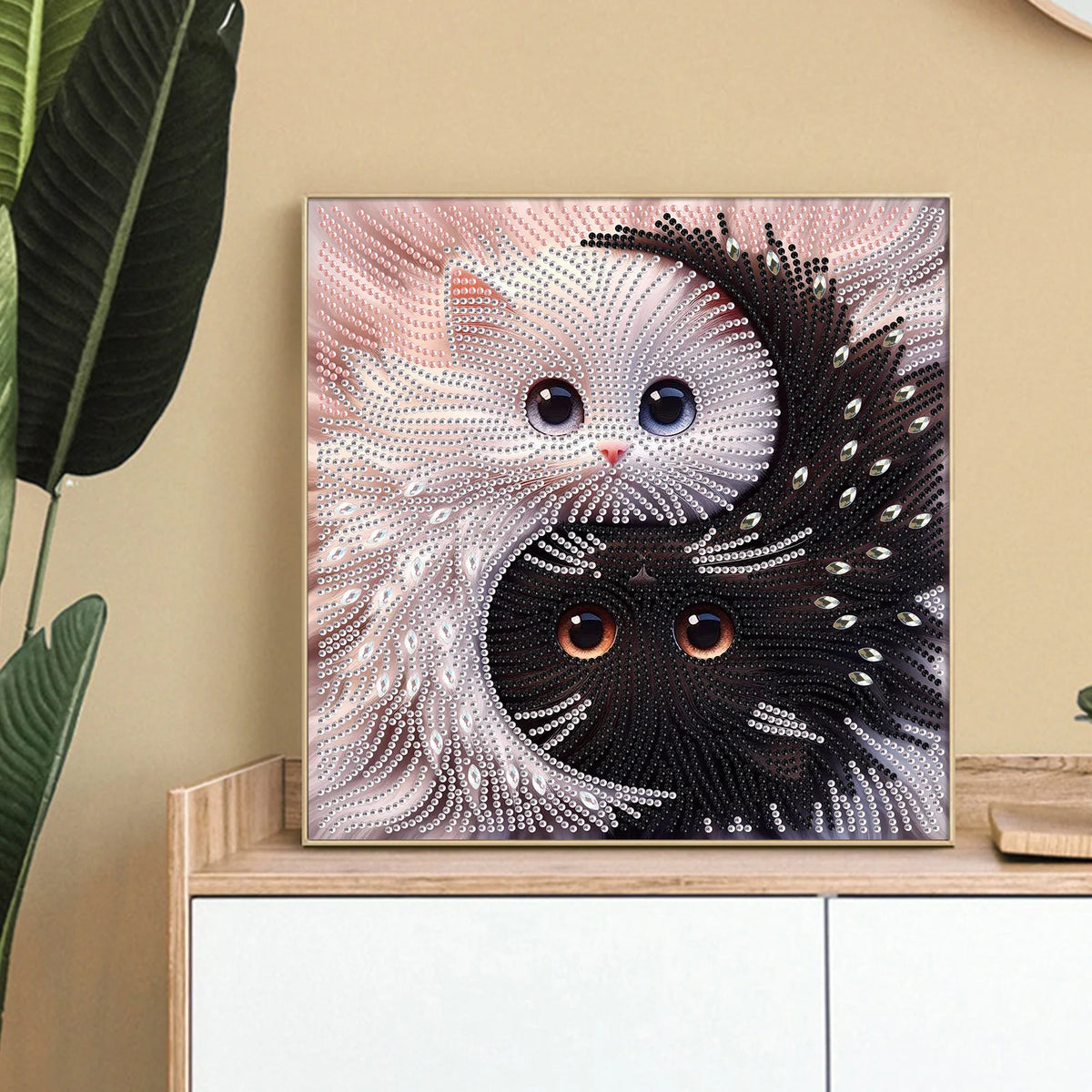 Diamond painting of a cat shaped like Yin Yang, featuring white and black fur patterns.