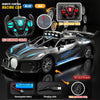 A black and blue R/C racing car with a remote control, battery, and charging cable displayed on a dark surface.