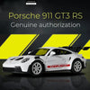 A white Porsche 911 GT3 RS model car is shown against a dark background with yellow stripes.
