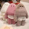 Three soft cuddly monster plush dolls in white, pink, and gray with pants