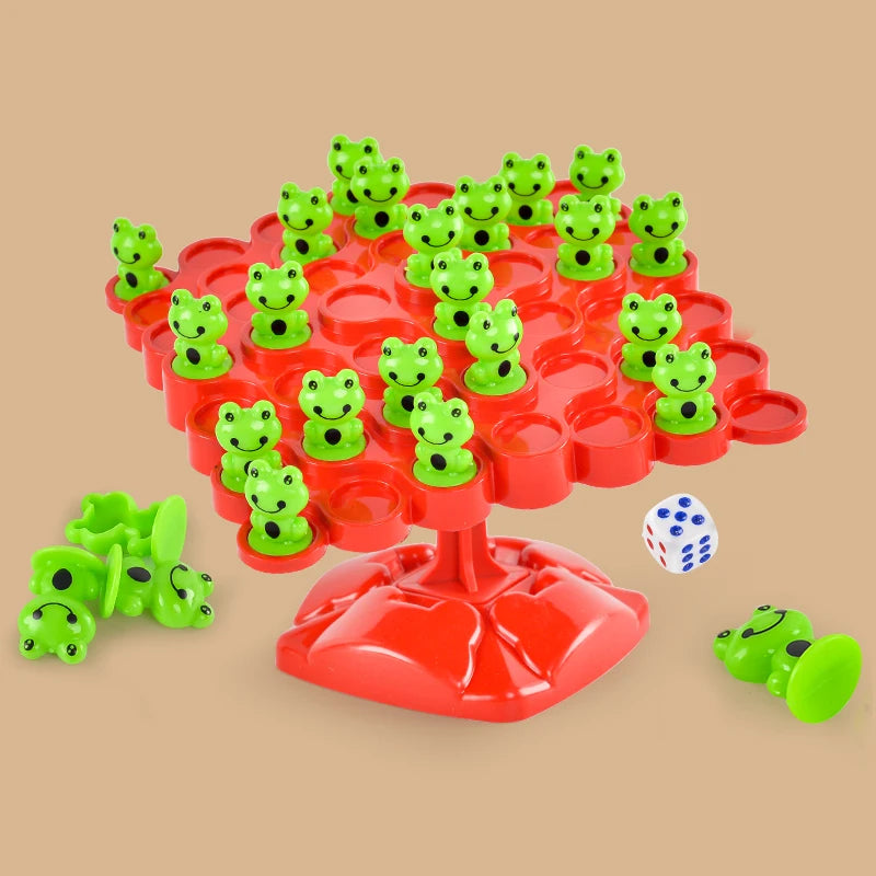 A red plastic tree structure with green frog figures used for a balance game.
