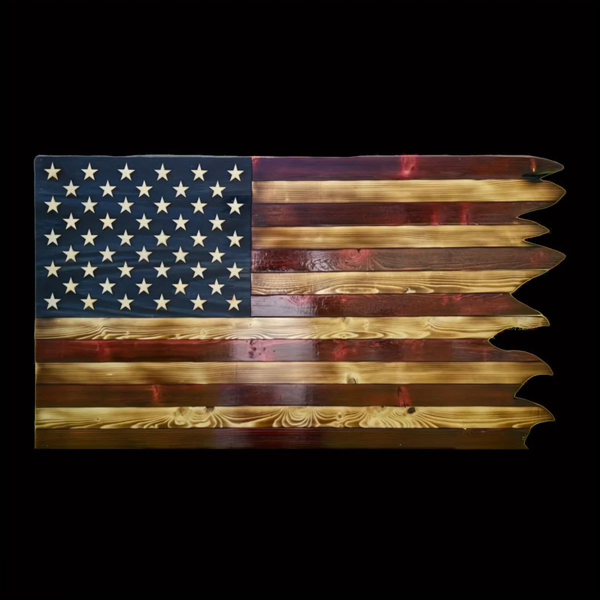 A wooden flag featuring the American flag design with wavy edges, used as patriotic wall decor.