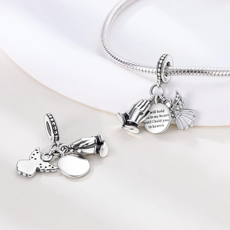Sterling silver charm beads set featuring cross, angel, and evil eye designs for DIY jewelry making