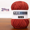 Two skeins of reddish-brown soft chunky yarn labeled as Butiaoxian Yangbaobao for crochet and knitting
