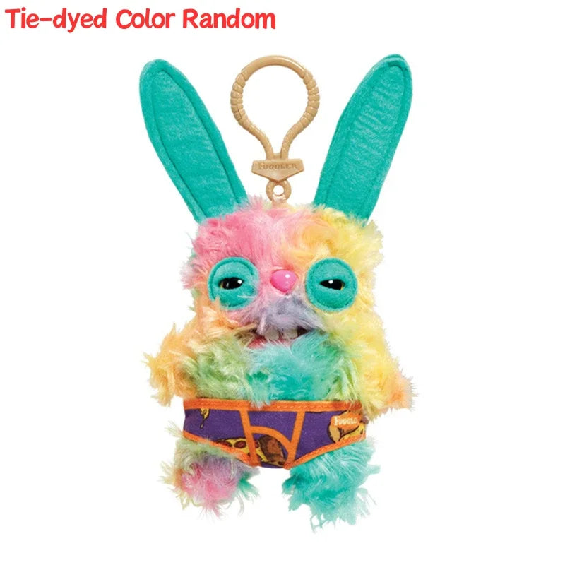 Tie-dyed color random plush monster keychain with rabbit ears and an orange belt