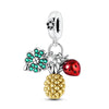 A silver fruit charm bead set featuring a flower, a strawberry, and a pineapple.
