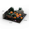 A building block set depicting a haunted house scene with plants, pumpkins, and stone structures.