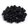 A pile of 50 imitation jade acrylic cloud beads in black, used for jewelry making and crafts.