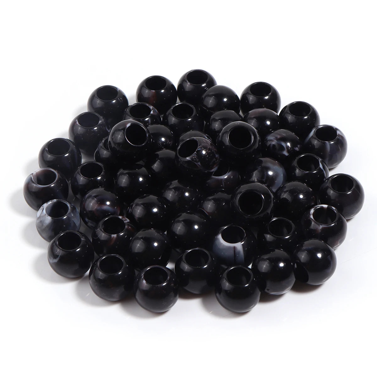 A pile of 50 imitation jade acrylic cloud beads in black, used for jewelry making and crafts.
