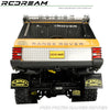 Rear view of a yellow Range Rover RC car with custom mud flaps and exhaust components.