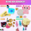 A blind box featuring various squishy toys including a blue orb, pink creature, and yellow butter blocks.