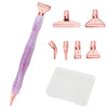 A set of pink resin diamond painting pens with interchangeable metal tips and multi-placers, including various sizes.