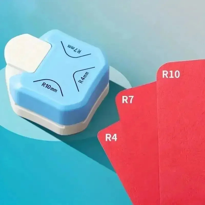 A set of blue and red rubber tools for embossing and cutting, showing various round and rectangular corner shapes.