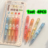 A set of four colorful fruit-scented quick-dry gel pens in various shades of pink, orange, and blue, packaged for sale.