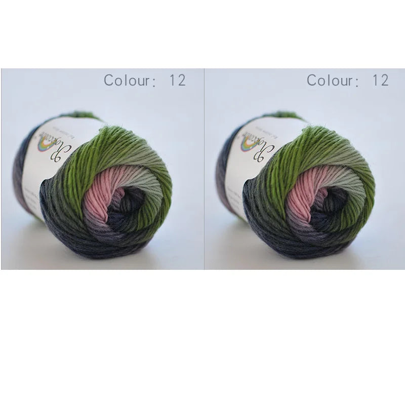 A ball of hand-dyed rainbow merino wool yarn in shades of green and pink, shown from the side.