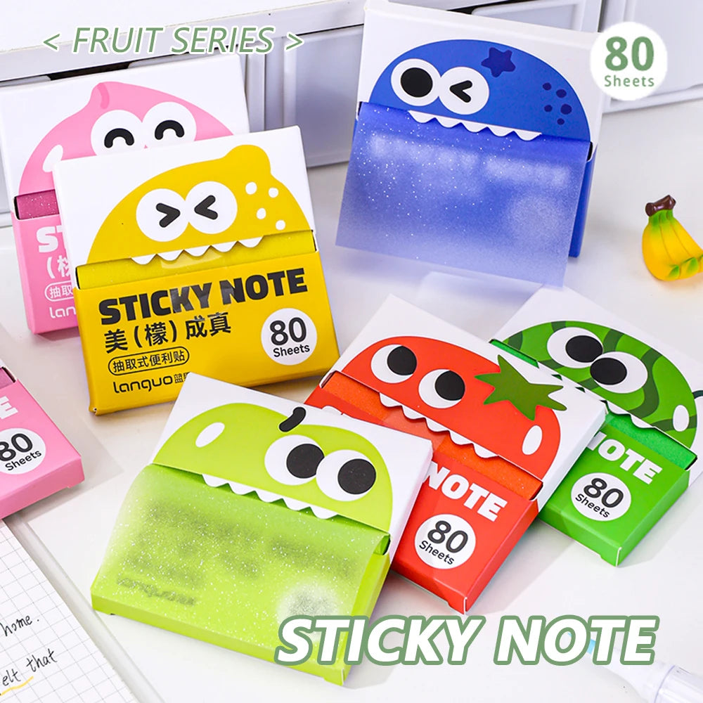 A collection of pearlescent clear sticky notes in various colors and a pull-through dispenser is displayed on a white surface