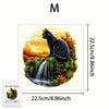 A black cat sitting on a mossy rock with a waterfall, part of a wooden jigsaw puzzle.