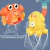 An orange suction cup bath toy featuring a rotating water spinner mechanism and a yellow rubber duck.