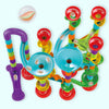 A colorful set of kids DIY marble run building blocks featuring various tubes and connectors in purple, green, orange, and re