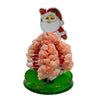 A crystal growing tree science kit featuring a Santa face decoration and a pink blooming tree on a green base.