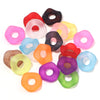 Assortment of candy colored acrylic spacer beads in various shades including pink, orange, yellow, and purple.