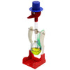 A red and blue drinking bird toy with a clear glass base and a red stand.