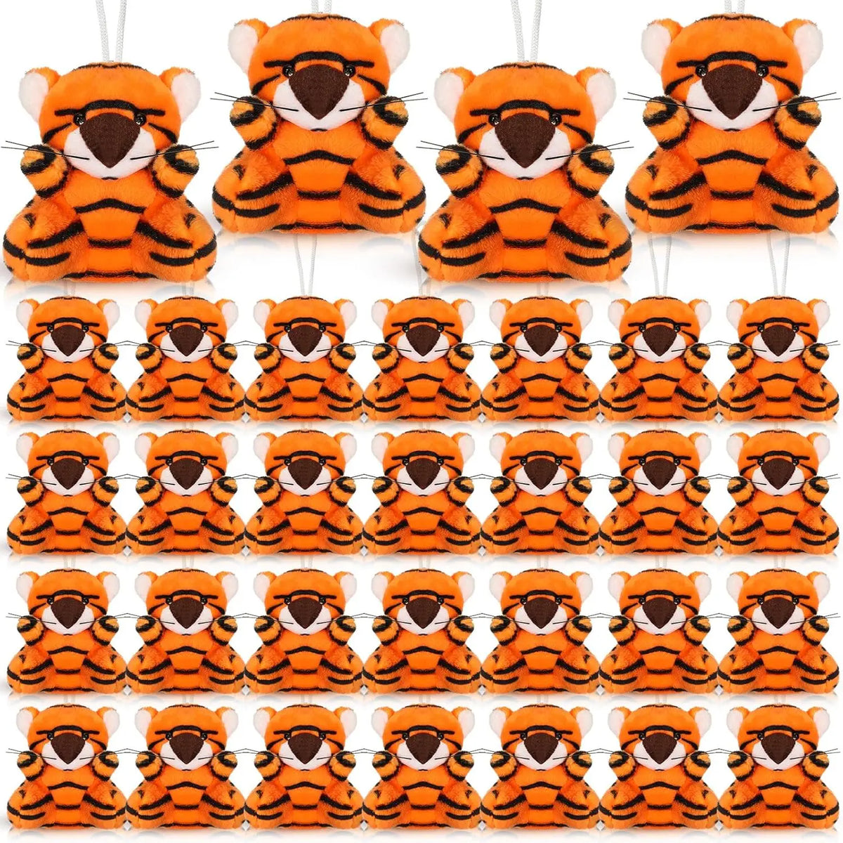 A collection of orange and black mini lion and tiger plush toys in various poses.