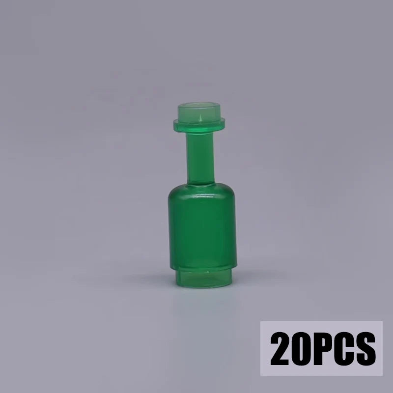 A single green plastic building block treasure chest component with a cylindrical top.