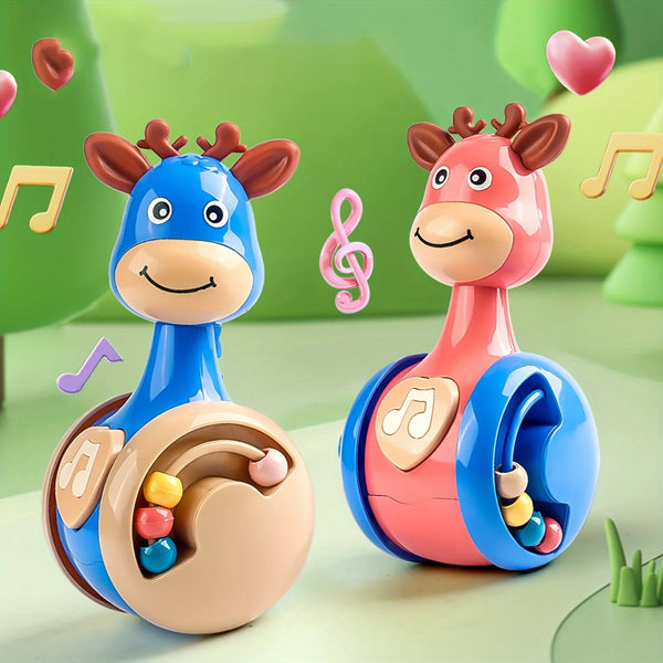 A pink and blue fawn sliding rattle toy with antlers is shown against a light green background.