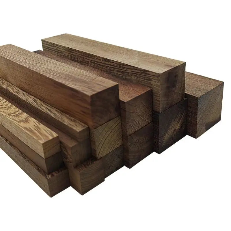 A stack of unfinished natural African wenge hardwood blanks used for carving and handle crafting.