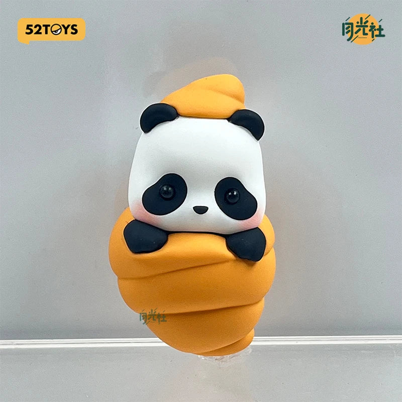 A cute panda collectible figure shaped like a yellow ice cream cone, displayed on a wall.
