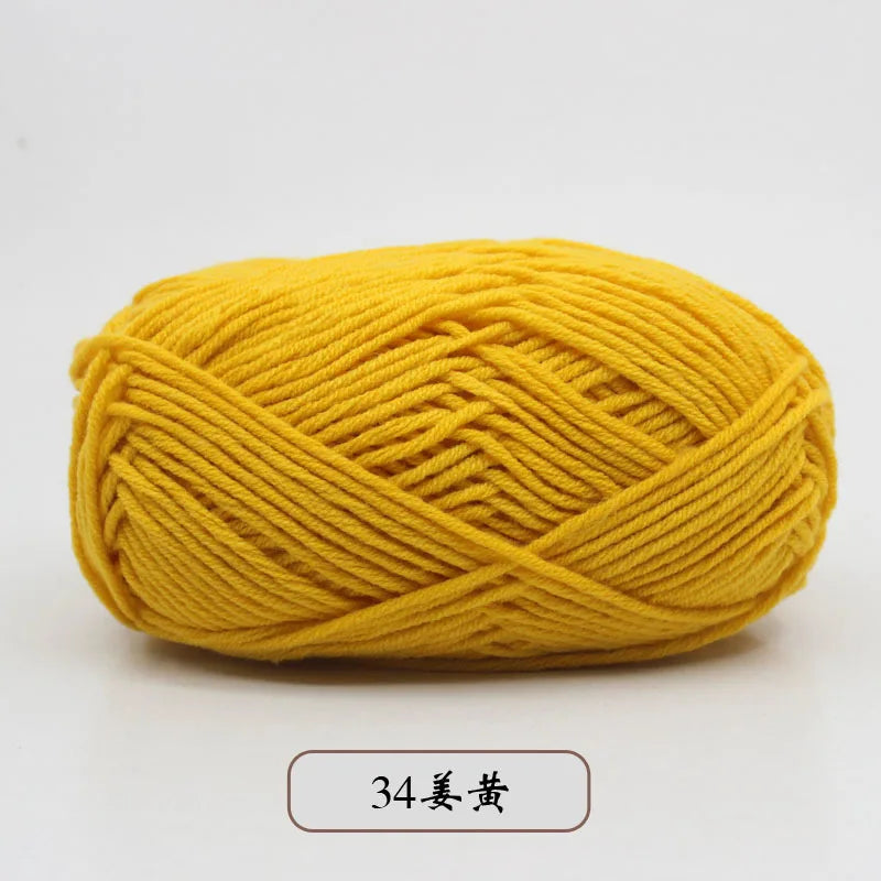 A ball of bright yellow pre-dyed milk cotton yarn used for knitting and crochet.