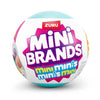 A Zuru Mini Brands Mystery Ball collectible toy with a pink and blue design.