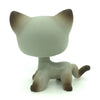 A small, gray and brown standing dog figure resembling a Littlest Pet Shop style toy.