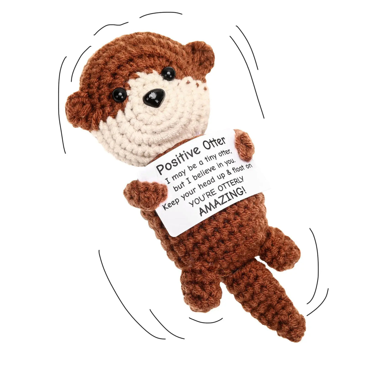 A handmade crochet otter plush toy with brown fur and white accents, featuring a tag that reads Positive Otter.